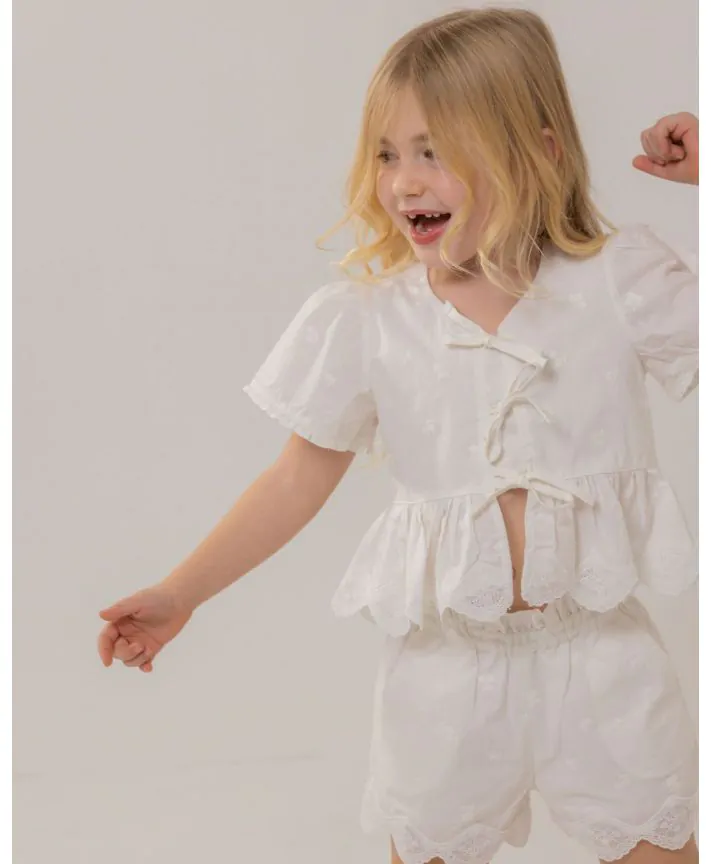 חולצת אריג עם מלמלה ופפיונים